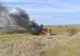Un autoturism a cazut de pe digul Oltului și a luat foc
